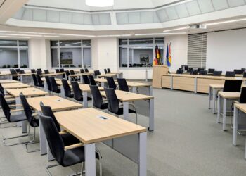 Photo by Andre: https://www.pexels.com/photo/empty-government-meeting-room-in-niedersachsen-34672722/